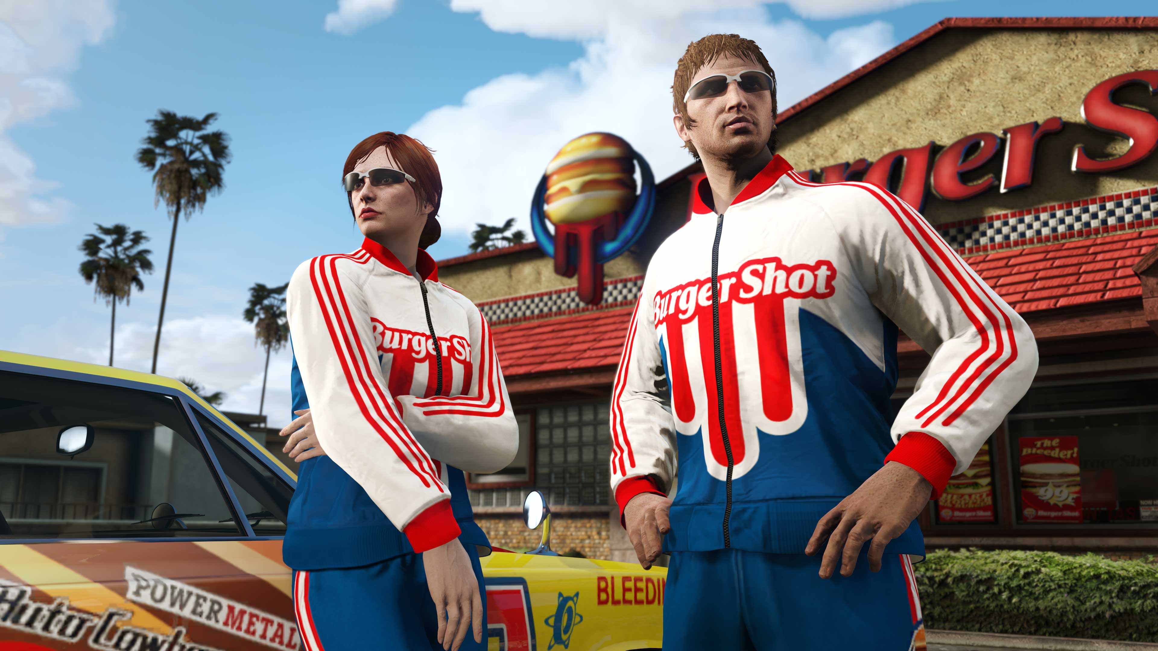 Outside a Burger Shot building, two GTA Online characters wear the Burger Shot Tracksuit outfit.