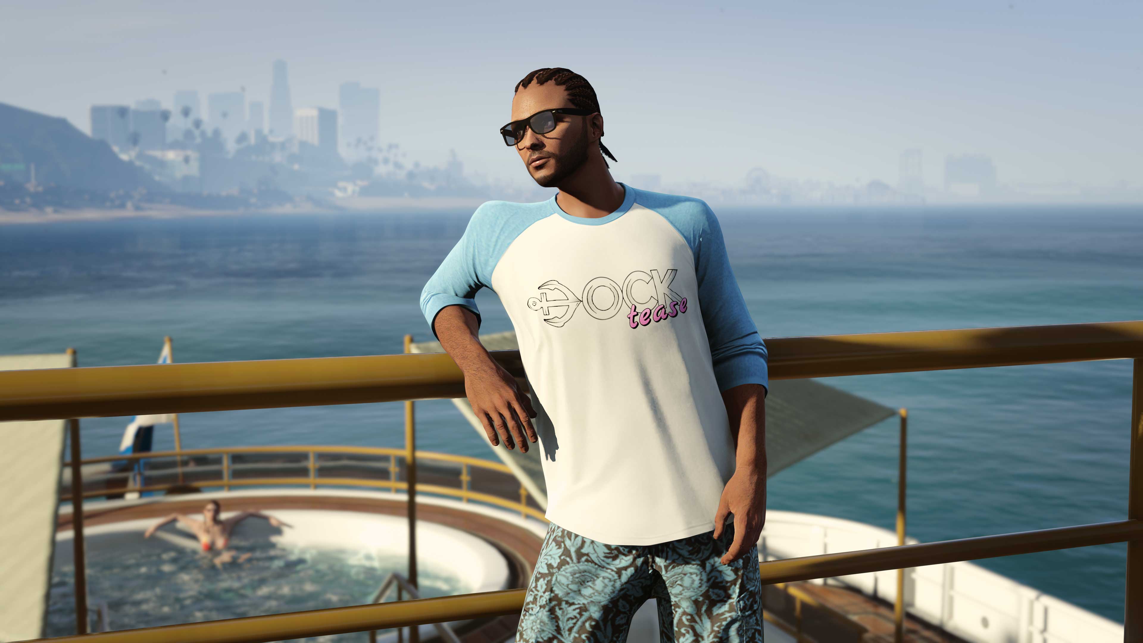 A character poses against a railing wearing their blue and white long-sleeved tee with rolled up sleeves. The graphic reads “Dock Tease”.