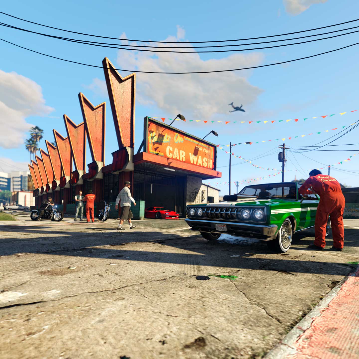 多名 GTA 在线模式角色身处亲力亲为洗车行。