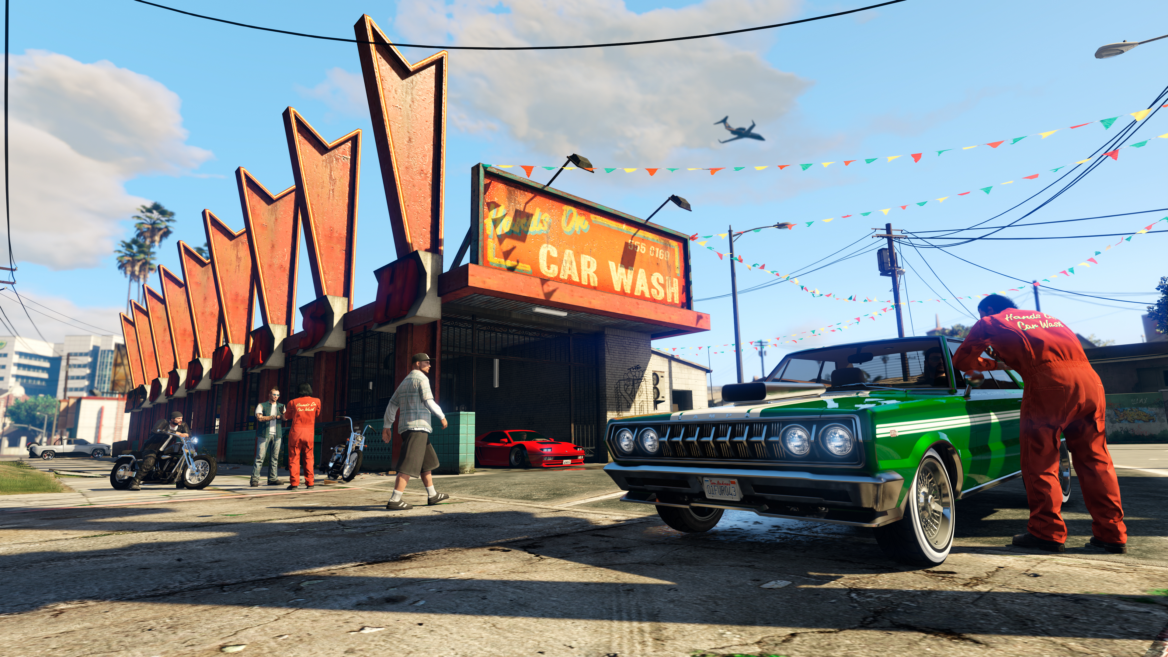 多名 GTA 在线模式角色身处亲力亲为洗车行。